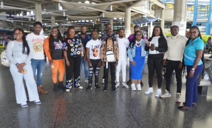 The first cohort of Barbadians who have taken up employment in New Brunswick, Canada pose with acting Senior Employment Officer at the Barbados Employment and Career Counselling Service, Lana Mapp (right) at the Grantley Adams International Airport. (P. Harper-Grant/BGIS)