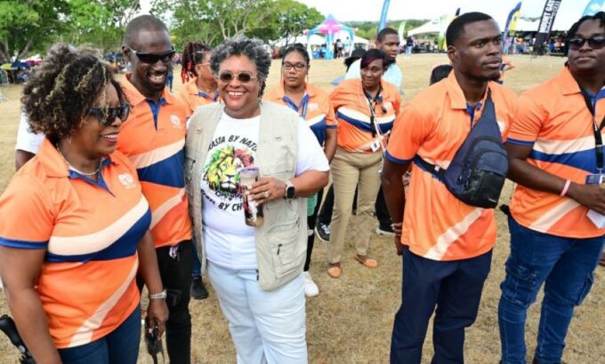 Prime Minister Mia Amor Mottley chatting with staff of the National Insurance and Social Security Service (NISSS) during the May Day celebrations at the National Botanical Gardens last Friday. (GP)